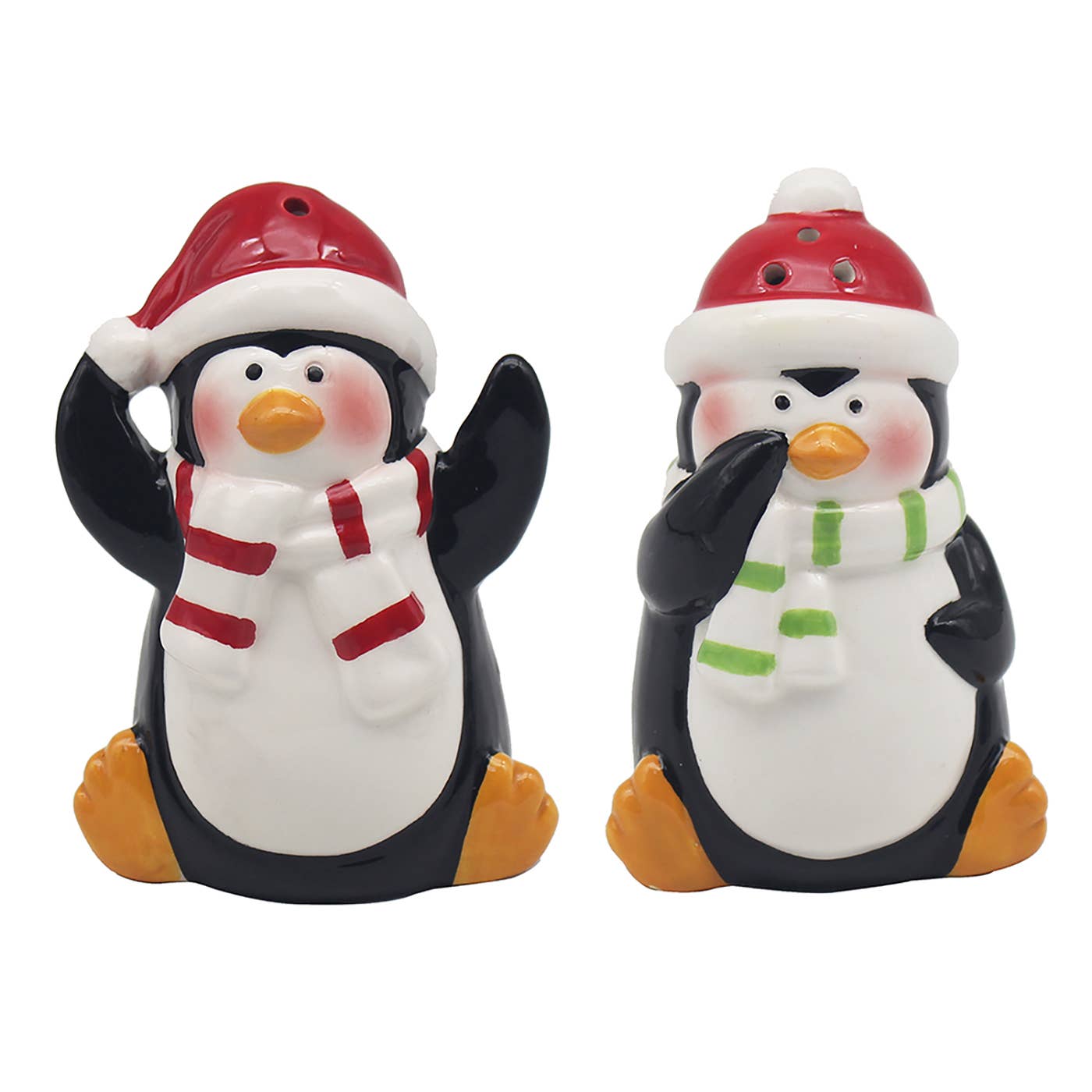 Twee keramieken kerst zout- en peperstrooiers in de vorm van pinguïns met kerstmuts en sjaal – rood en groen