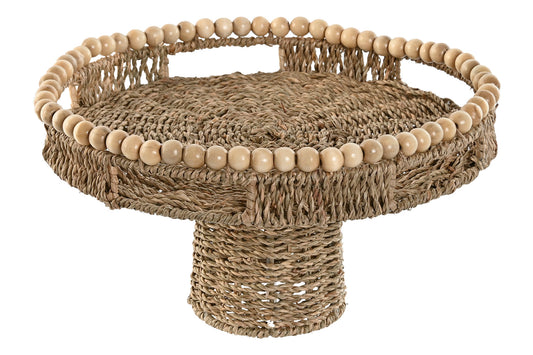 Decoratief rond zeegras plateau op verhoogde voet met houten kralenrand en handgrepen voor een Bali, boho en coastal interieur.